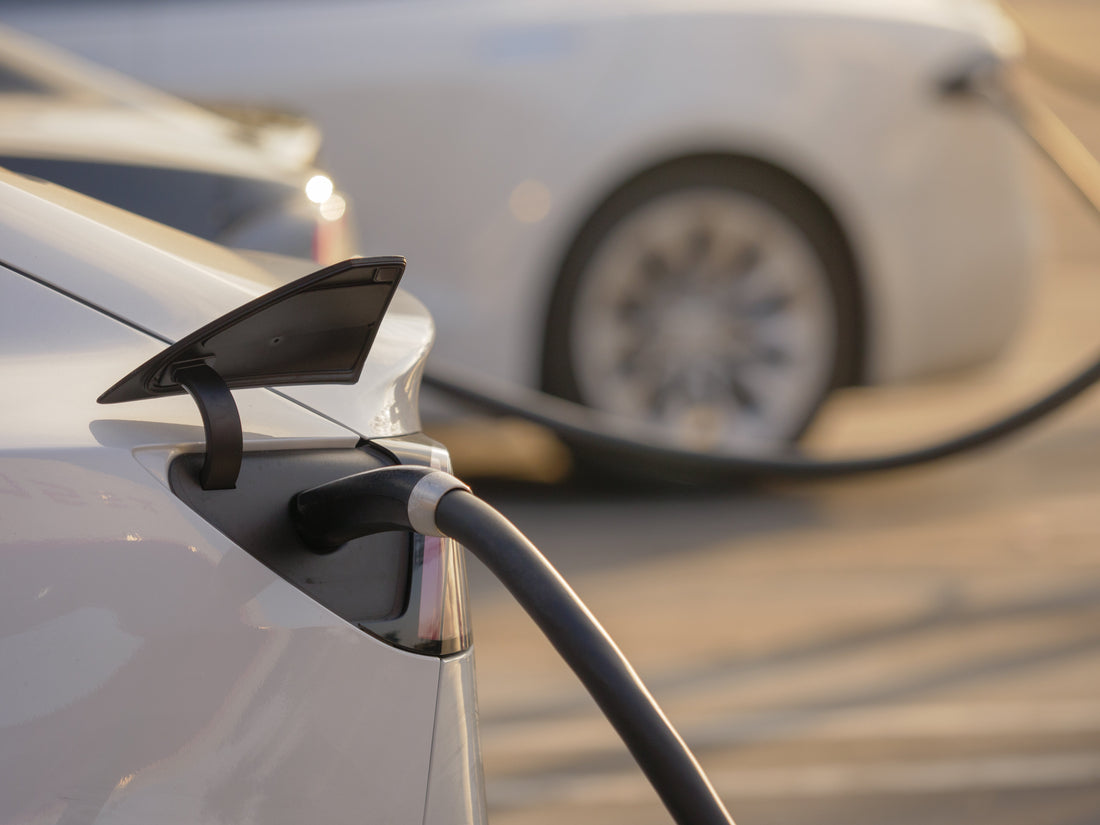 Electric vehicles charging at sunset — best dash cams for EVs in Australia