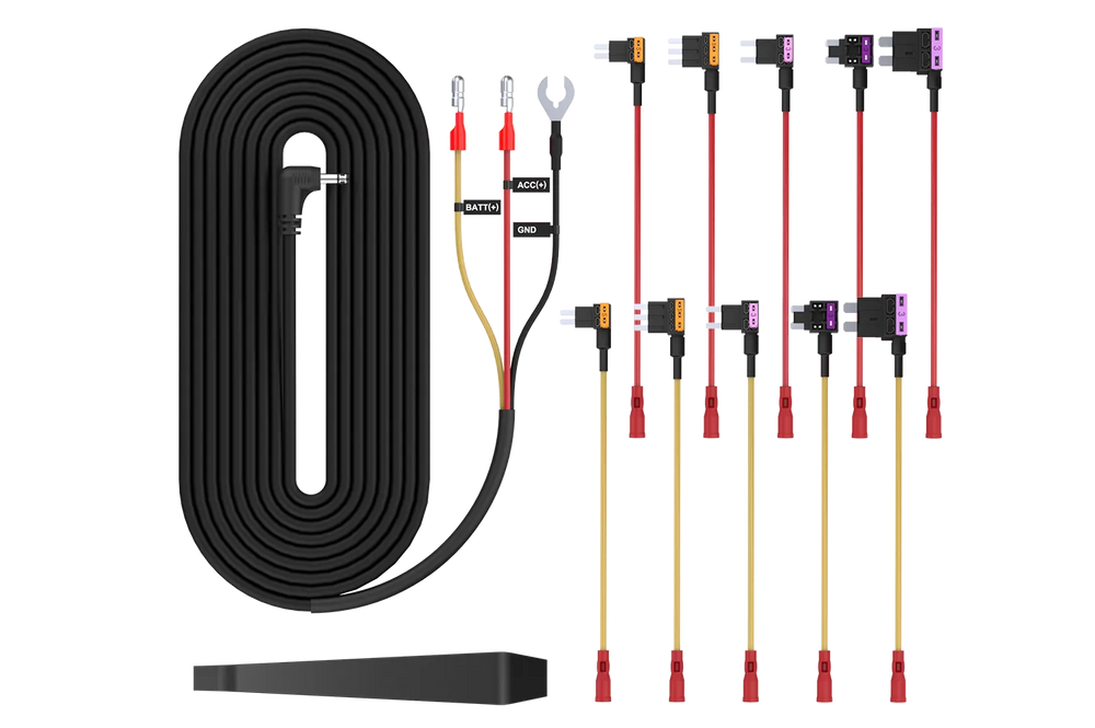 Contents of a dash cam hardwire kit laid out - cable, add-a-fuses and ring terminal
