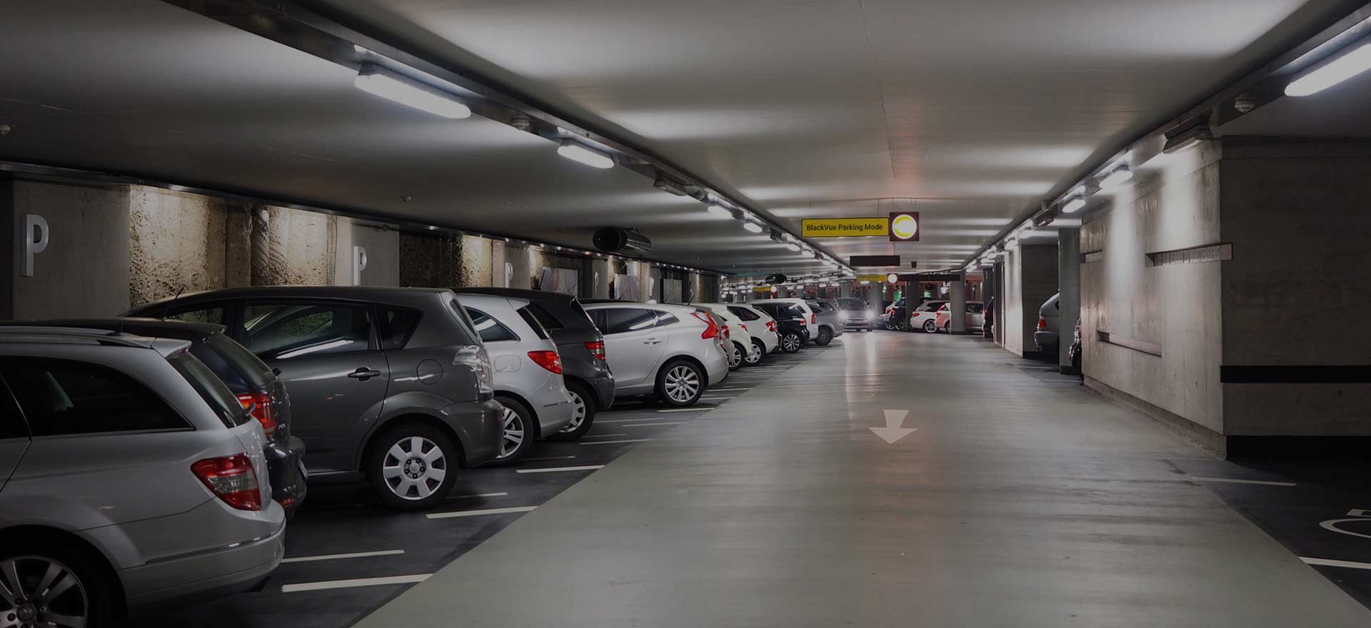 Car parked at night protected by dash cam parking mode